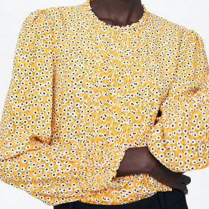 yellow blouse with flowers